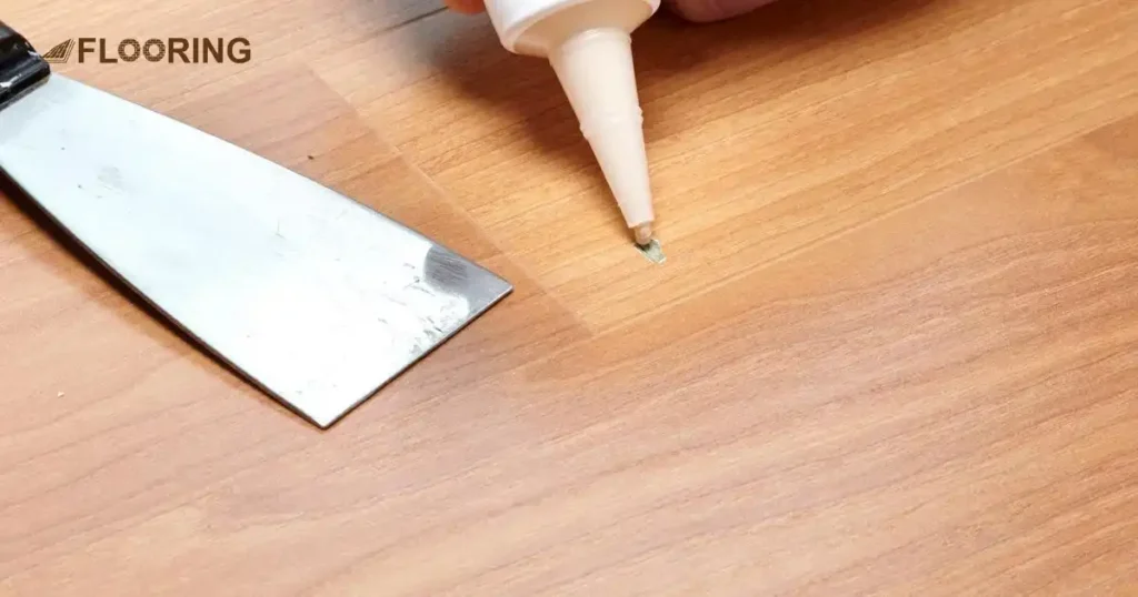 Fill In Chips Using Putty to Repair Chipped Laminate Flooring